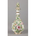 A large Rockingham scent bottle with pear-shaped body and flared tapering neck. With gilt bands,