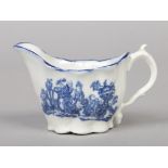 A Caughley low Chelsea ewer. Printed in underglaze blue with the Mother and Child pattern c.1780,
