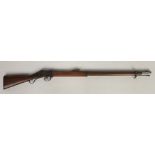 A Martini Henry .577 rifle. With walnut fullstock, ramrod and adjustable ladder sights. Barrel 83cm.