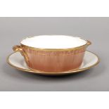 A Sampson Bridgwood & Son porcelain butter tub on stand with scroll handles. Brown glazed and with