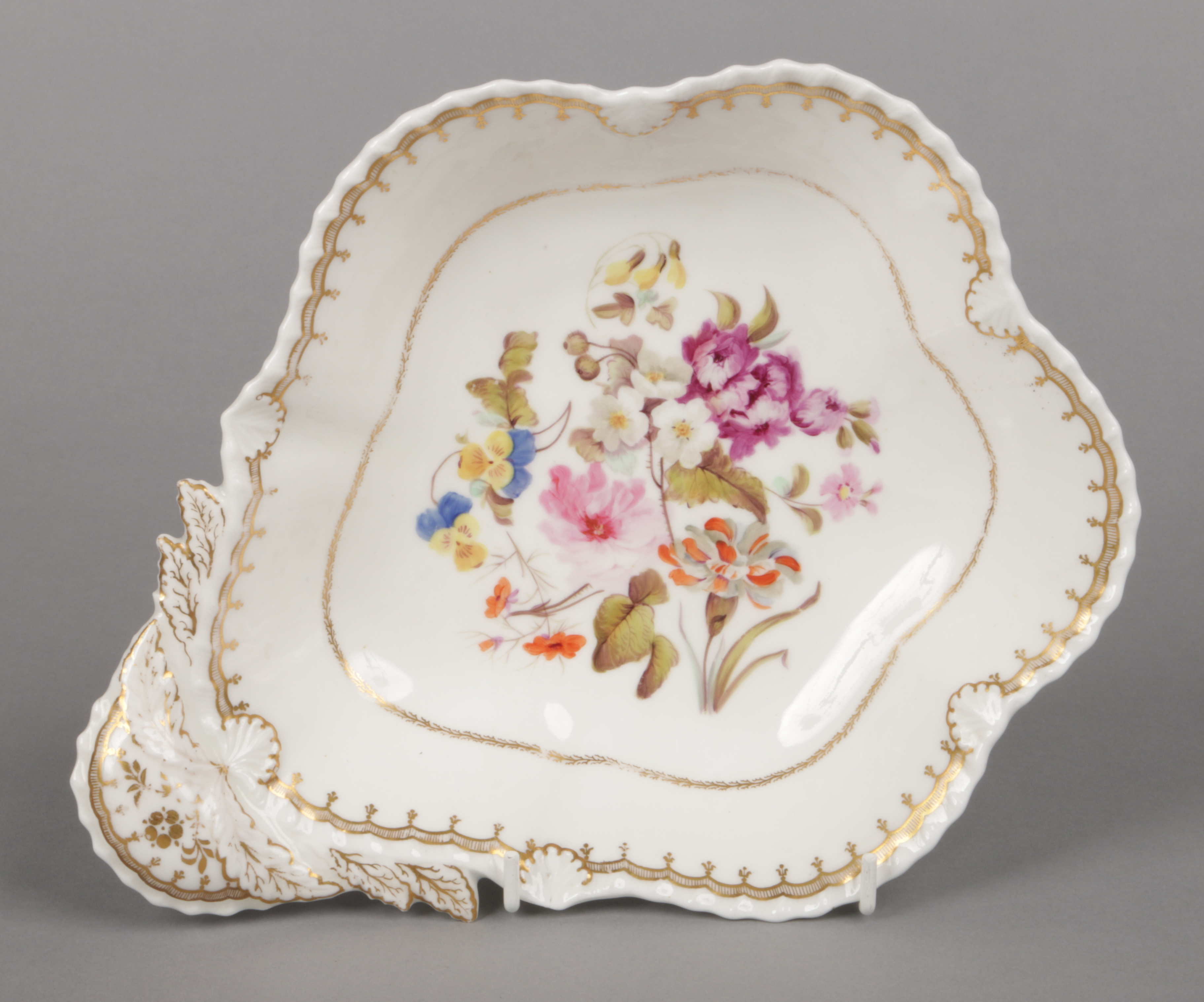 A Rockingham dessert dish with anthemion and gadroon moulding. With gilt borders and delicately