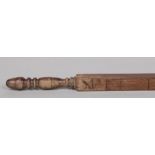 A Victorian mahogany cloth measure. With turned grip and incised markings, 81.5cm.Condition report
