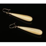 A pair of early 20th century 9 carat gold mounted turned ivory drop earrings, 47mm.Condition