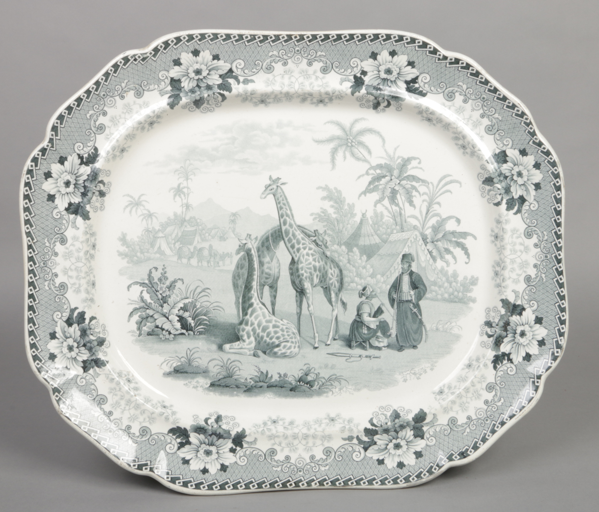 A John Ridgway meat plate. Printed in green with the Giraffe pattern. Depicting three giraffes in an