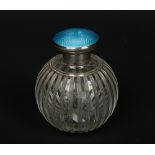 A George V cut glass globular scent bottle. With hinged silver top having blue guilloche enamel