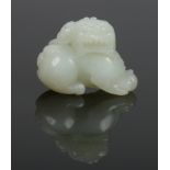 A 19th century Chinese small carved pale celadon jade model of a shi shi dog, 2.5cm.Condition report