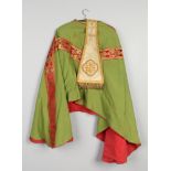 A priests cope vestment and stole with gold and claret silk embroidery.