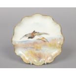 A Royal Doulton scalloped cabinet plate painted by C. Hare. Decorated with a pair of mallards in
