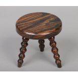 A simulated rosewood lace makers lamp stool raised on bobbin turned supports, 15cm.Condition