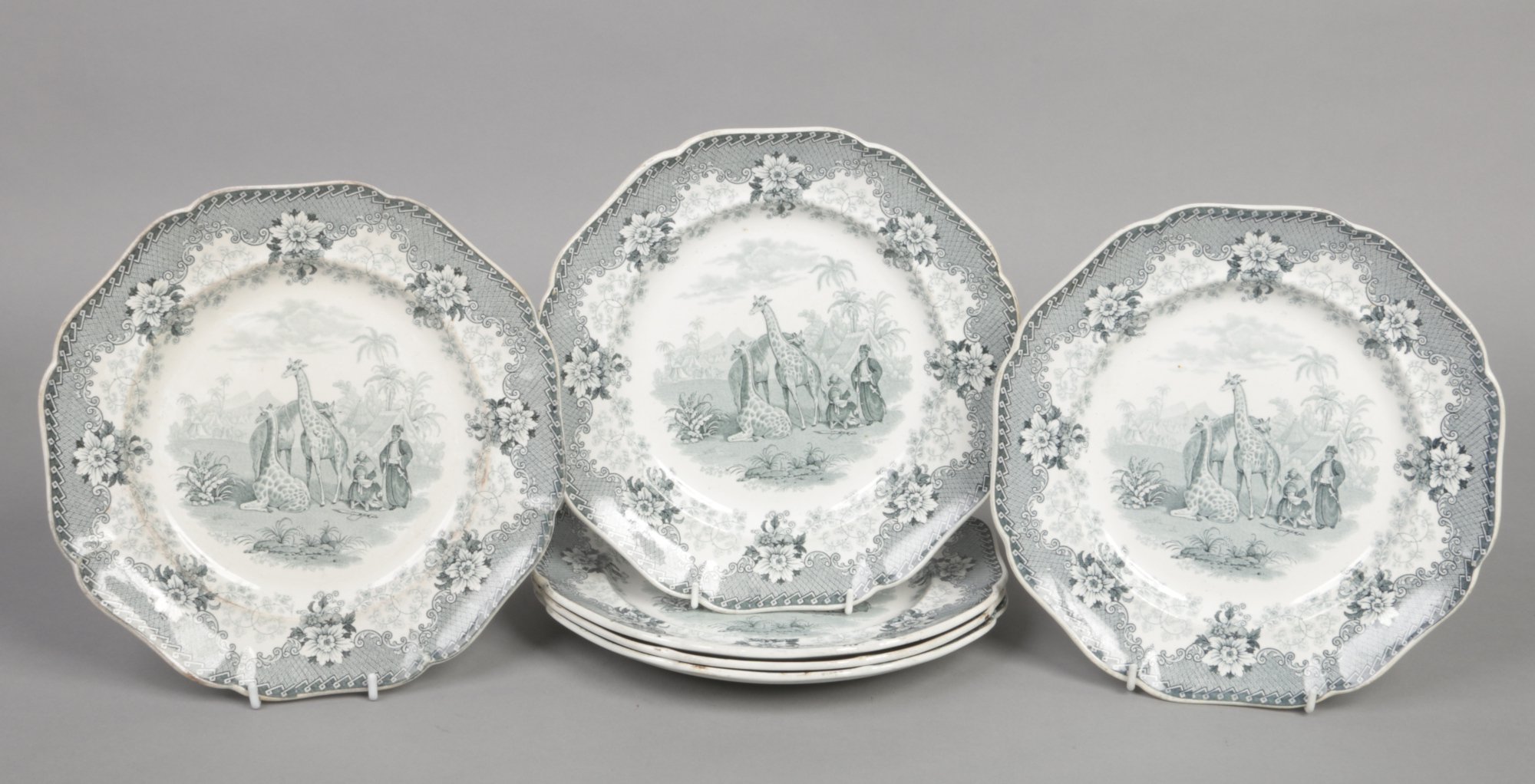 Six John Ridgway dinner plates. Printed in green with the Giraffe pattern, depicting three