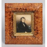 A 19th century watercolour portrait miniature of a gentleman in oyster veneered cushion shaped