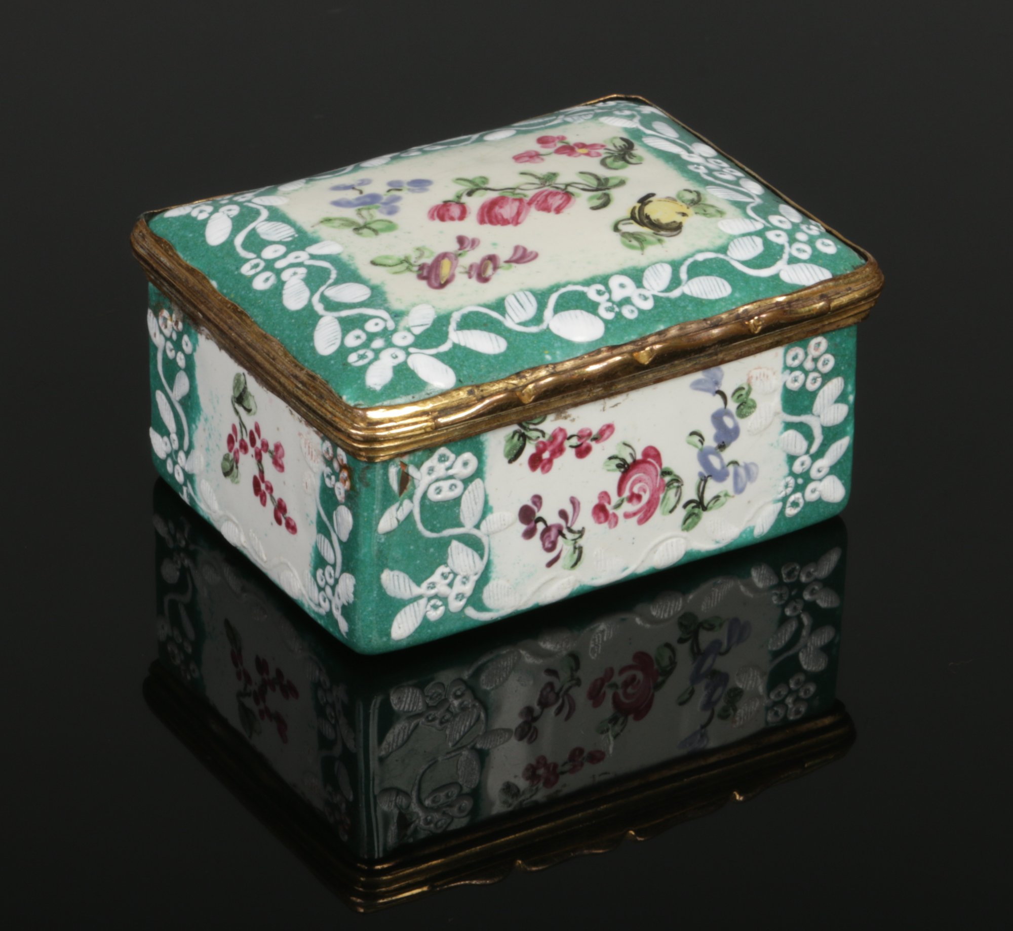 An 18th century enamel snuff box of rectangular form and with gilt metal mount. Green ground,