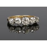 An 18 carat gold five stone diamond ring. Set with five graduated Old European cut diamonds.