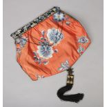 An early 20th century Chinese embroidered silk evening bag, 42cm wide.