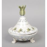 A 19th century Continental faience deskstand with flame taper stick finial and raised on three