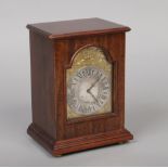 A Mahogany cased Silver Jubilee mantel clock by Charles Frodsham. With silver and silver gilt arch