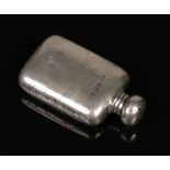 A George V novelty silver scent bottle formed as a miniature hip flask by Arthur & John Zimmerman.