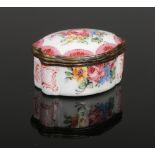 An 18th century enamel pill box of scalloped lozenge form. Painted with roses and with rose