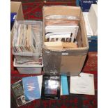A box of rock memorabilia to include live VHS tapes, books, posters etc, along with two boxes of