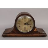 An Art Deco oak cased 8 day mantle clock striking on gongs.