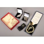 A collection of costume jewellery to include silver brooch, stud earrings, Napier necklace etc.