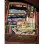 A box of mixed books and P.C games to include Observer and Yorkshire County Cricket Club books,