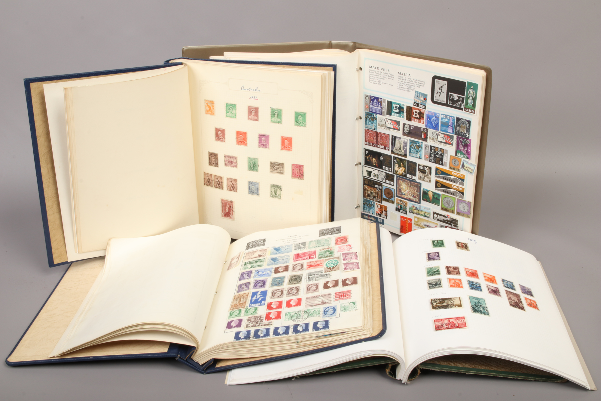 Four albums of world stamps to include 19th century examples.