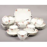 A Shelley Queen Anne tea set decorated in the red daisy pattern 12 trios minus 1 cup, bread and