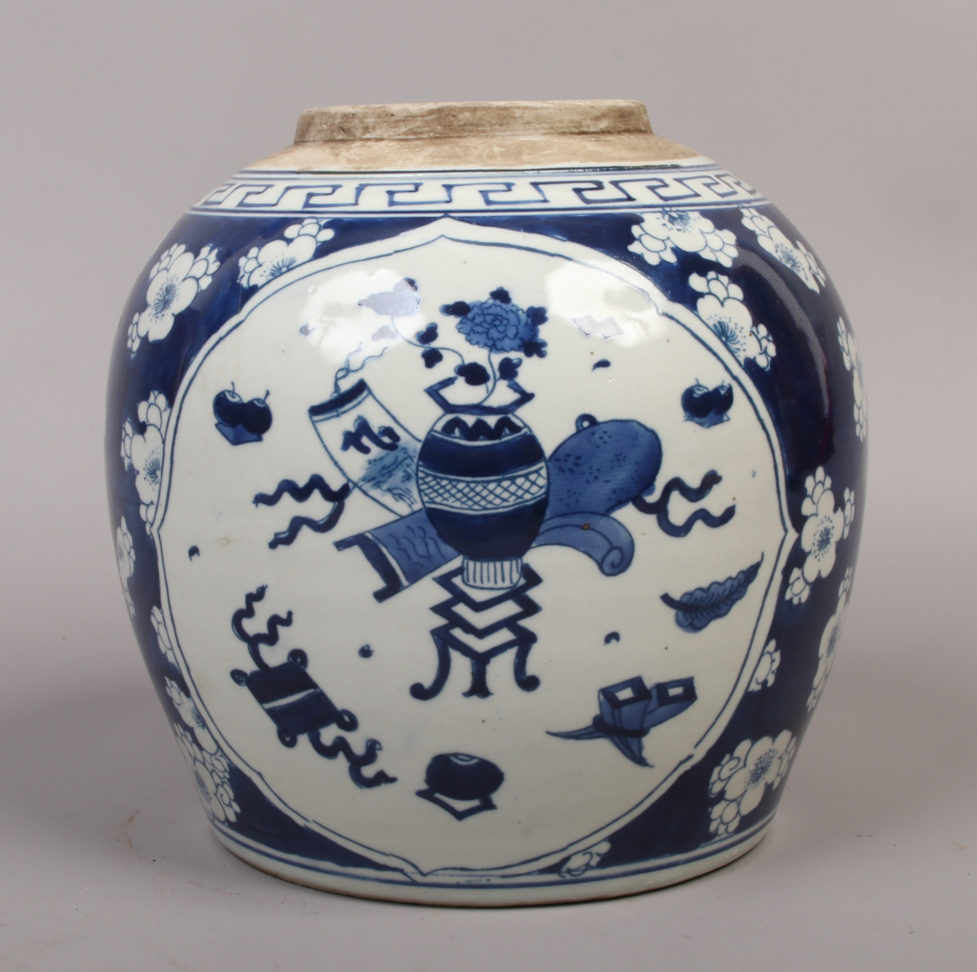 A 19th century Chinese blue and white ginger jar painted in underglaze blue with panels of