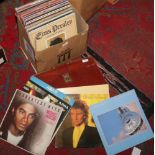 A box of L.P records to include Rod Stewart, ABBA, Dire Straits etc along with a cowhide briefcase