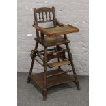 A Victorian carved oak metamorphic child's high chair.