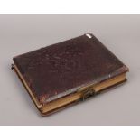 A late 19th / early 20th century photograph album and contents of monochrome portrait photographs.