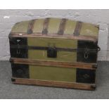 A painted metal bound dome top travel trunk.