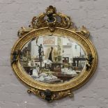 A gilt oval wall mirror surmounted with putti.