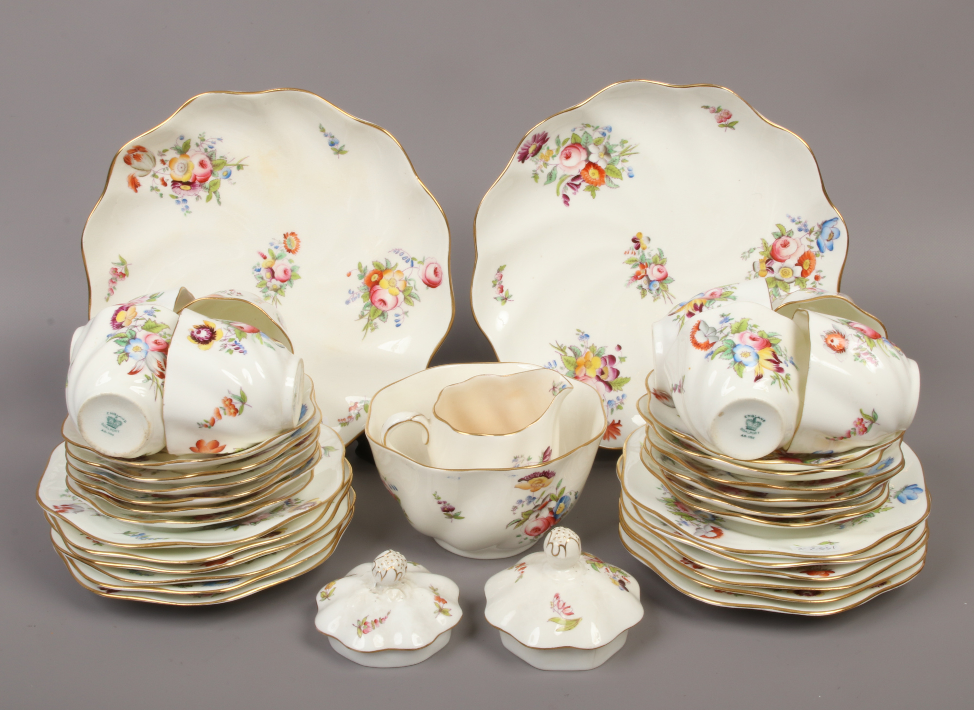 A collection of Coalport bone china teawares of scolloped design decorated with flowers, 36 pieces.