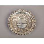An Edwardian silver bon bon dish by Fenton Bros. With scalloped shell moulded rim and embossed