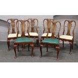 A set of six antique Queen Anne style walnut dining chairs.