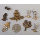 A collection of military badges and a World War II medal to include Royal Signals, Royal Artillery