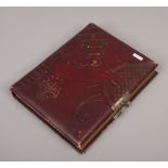 A late 19th / early 20th century photograph album and contents of monochrome portrait photographs to