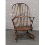 An Ercol spindle back rocking chair in need of restoration.