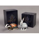 Two Royal Crown Derby collectors guild paperweights, Moonlight Badger and Starlight Hare.