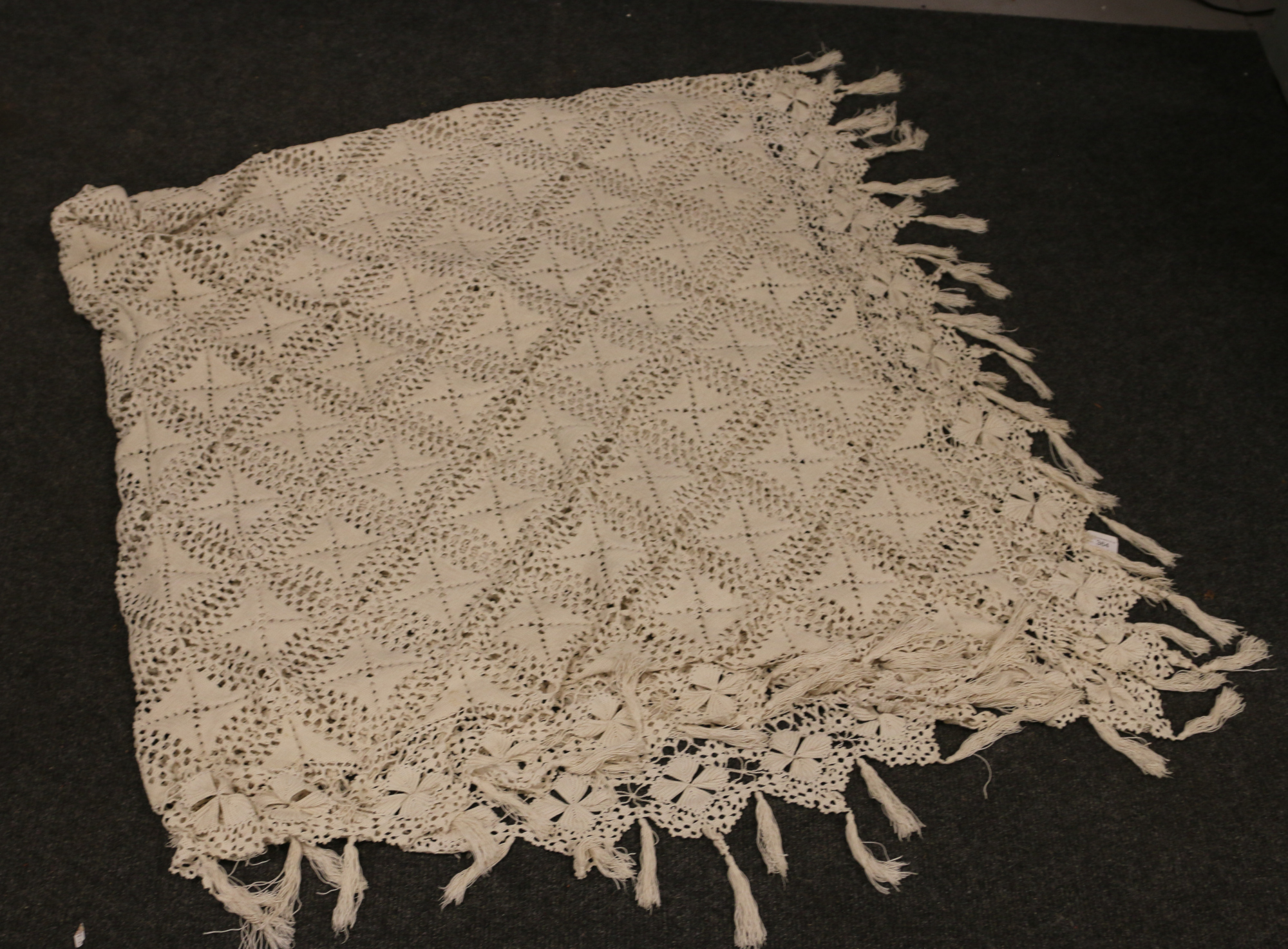 A crochet bed cover, 235cm x 215cm.