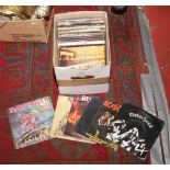 A box of rock single records to include Rainbow, Saxon, Deep Purple, Saxon, Deep Purple etc.