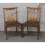 Two G- plan E Gomme dining chairs.