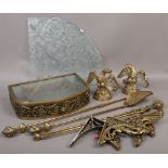 A brass fireside companion set with ball and claw handles, along with a wall mounting brass and