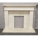 A reconstituted marble fire surround and hearth.