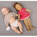 An Armand Marseille dream baby doll with bisque head along with a Chad Valley soft doll.