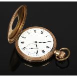 A gold plated half hunter pocket watch in Dennison case with white enamel dial and second subsidiary