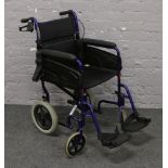 An Alu - Lite folding wheelchair.