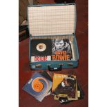 A suitcase of David Bowie single records, books and magazines.
